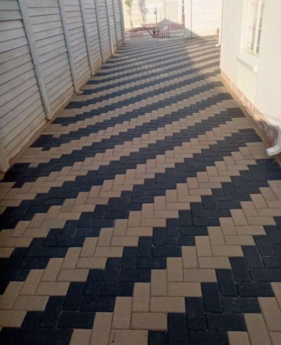 Elegant charcoal, grey and brown herringbone pattern concrete walkway