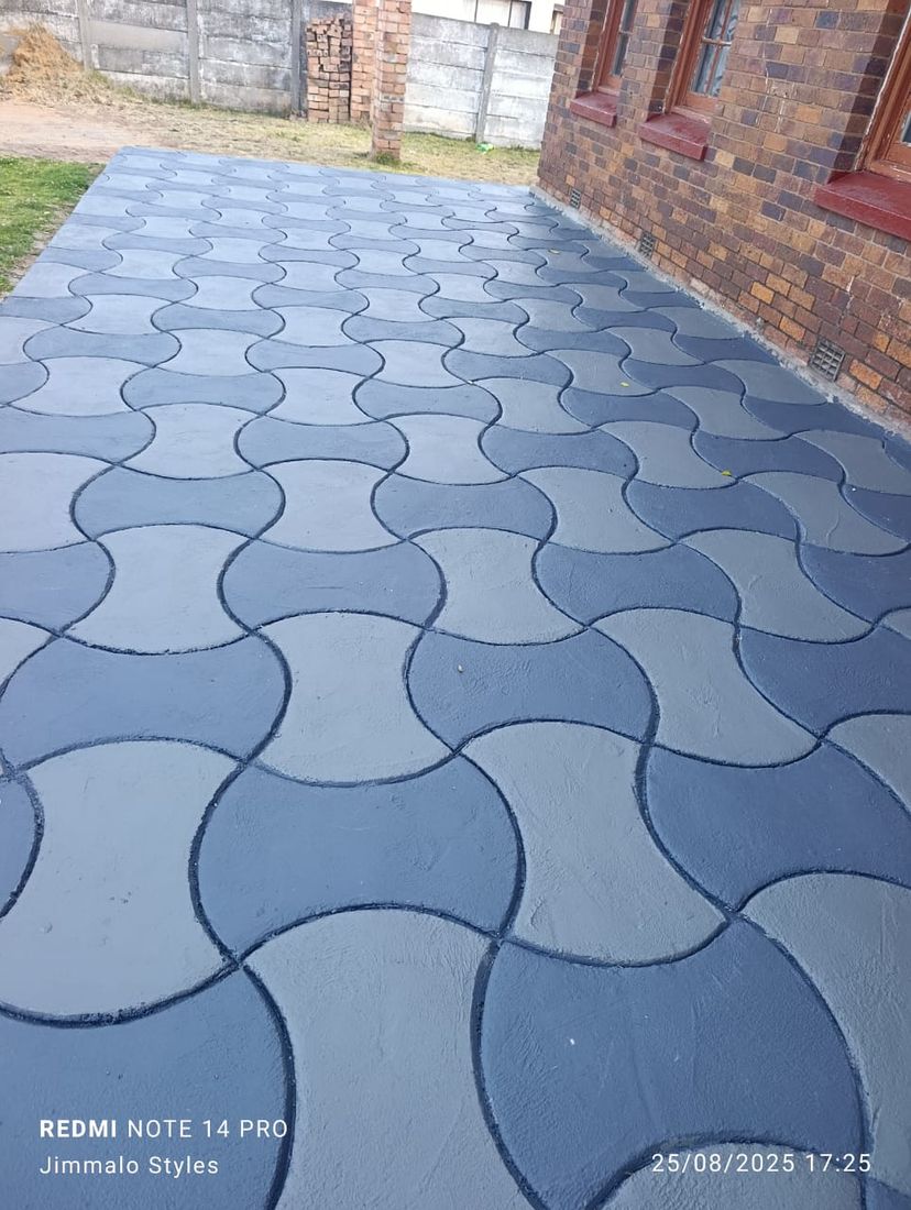 Grey and charcoal wave pattern decorative concrete entrance walkway